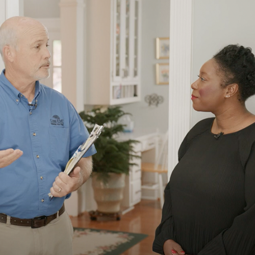 Employee discussing energy audit with a woman